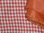 Close up of orange check fabric